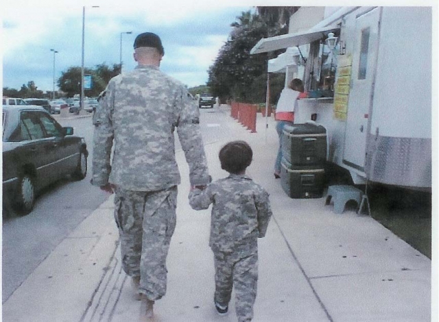 Shay Black, son of Jo Reed Leach and Mike Black, with his son, Wesley.